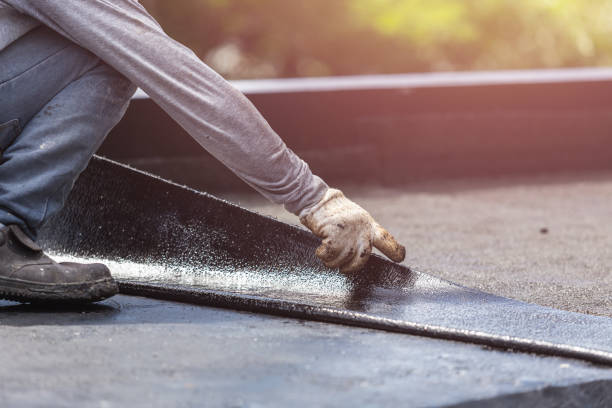 Professional Basement Waterproofing technician working in Chatham, VA